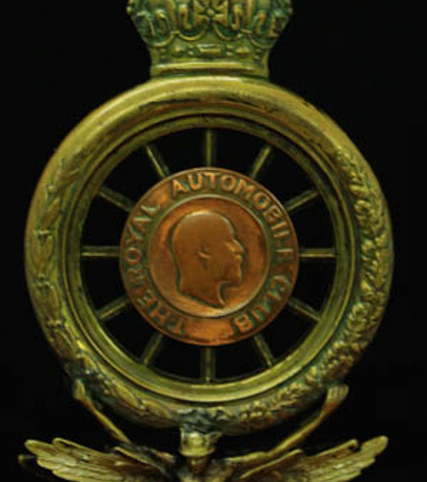 early brass hollow RAC badge